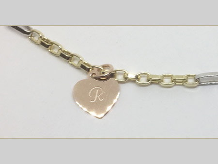 yellow gold anklet with white gold accent links, and rose gold engraved heart