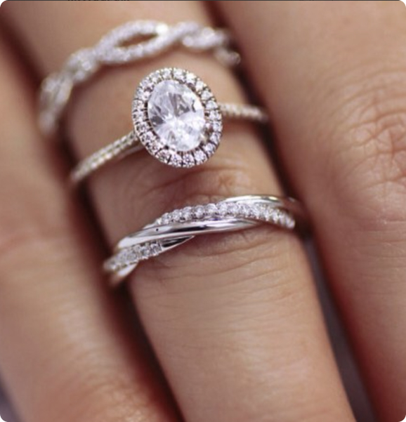 female hand with diamond engagement rings