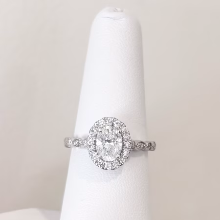 14K white gold oval diamond engagement ring with halo and diamond accent band